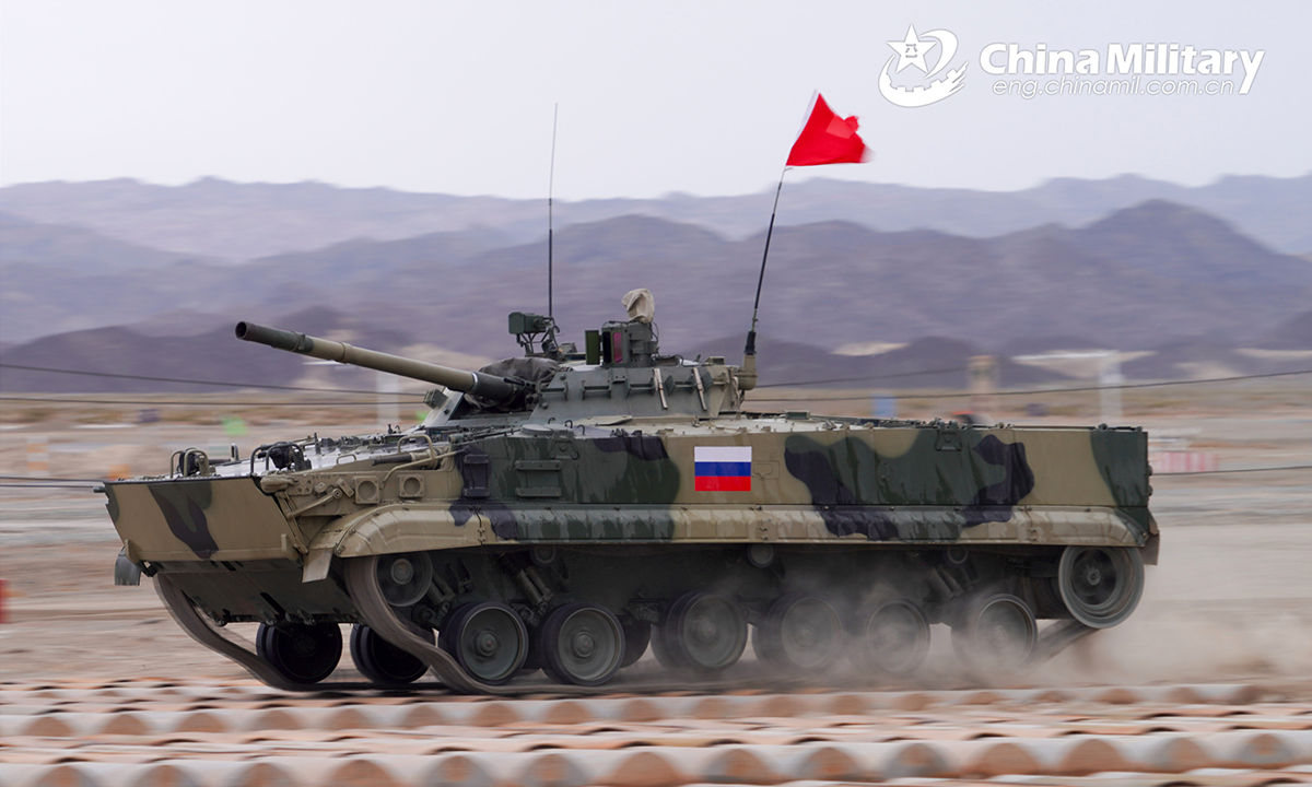 An infantry fighting vehicle of the Russian participating team leaps forward through the bumps obstacle during the second round of individual race of the Suvorov Onslaught contest in Korla, China's Xinjiang Uygur Autonomous Region, on August 16, 2022. The Suvorov Onslaught contest of the International Army Games 2022 (IAG 2022) kicked off on August 14 with participation of six teams from five countries, namely China, Russia, Belarus, Iran and Venezuela. (Photo by Luan Cheng)