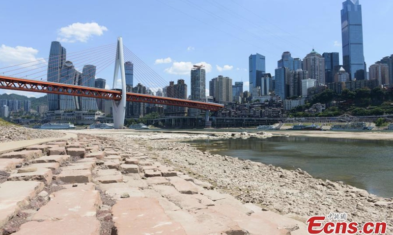 The dried-up riverbed of the Jialing River is exposed due to drought in Chongqing, Aug. 17, 2022. (Photo: China News Service/He Penglei)