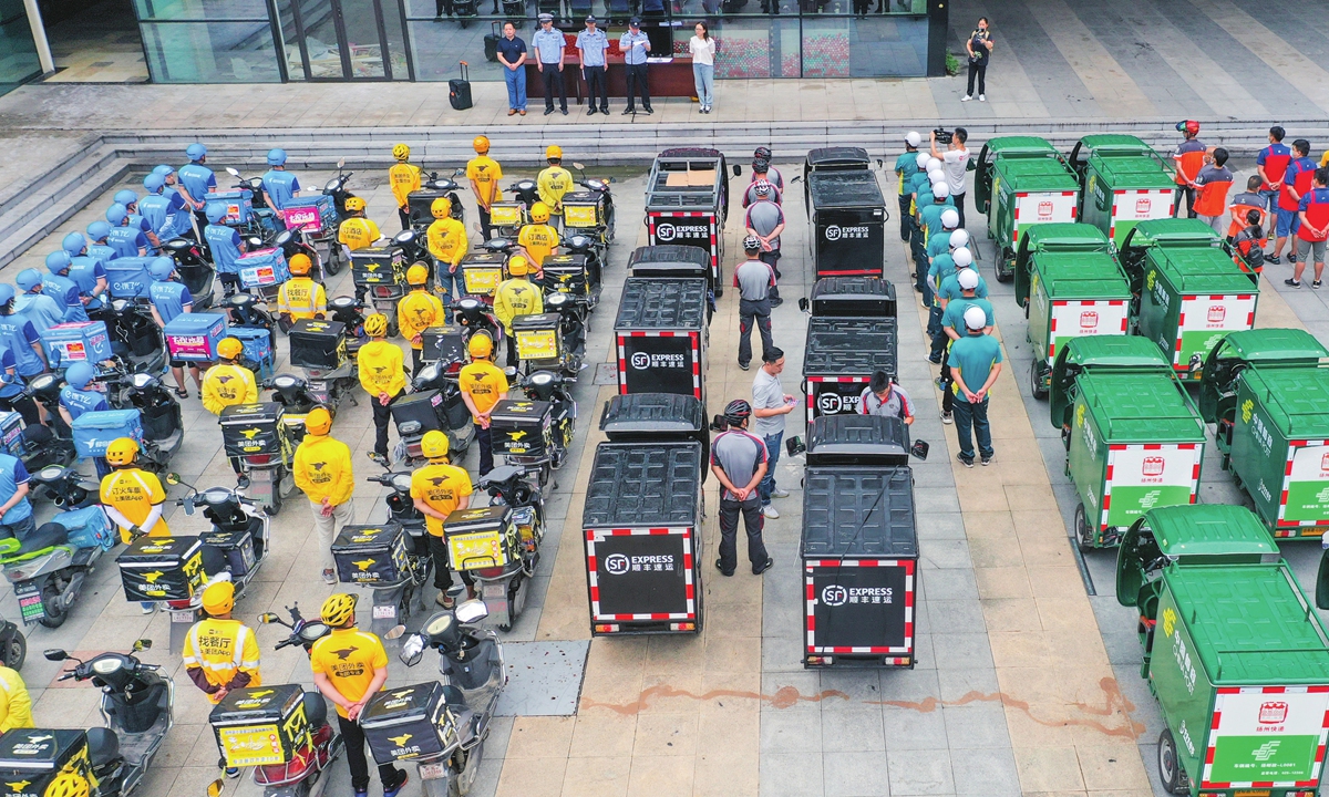 Deliverymen learn about traffic rules in Suzhou, East China's Jiangsu Province on July 31, 2020. Photo: VCG