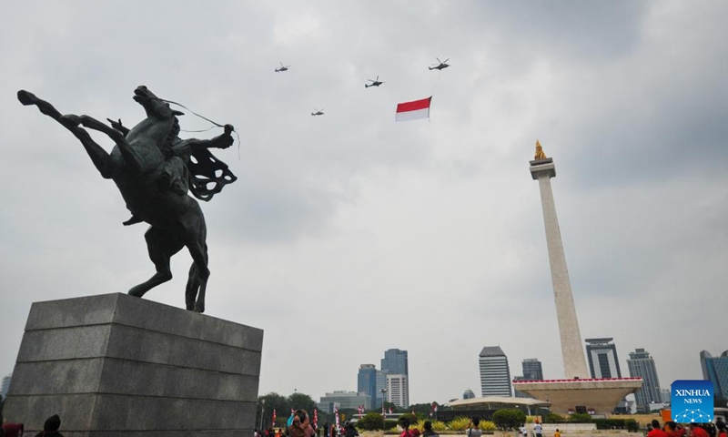 Indonesian Air Force's aircrafts hanging the national flag of Indonesia fly in formation over National Monument during the 77th Independence Day celebration in Jakarta, Indonesia, Aug. 17, 2022.(Photo: Xinhua)