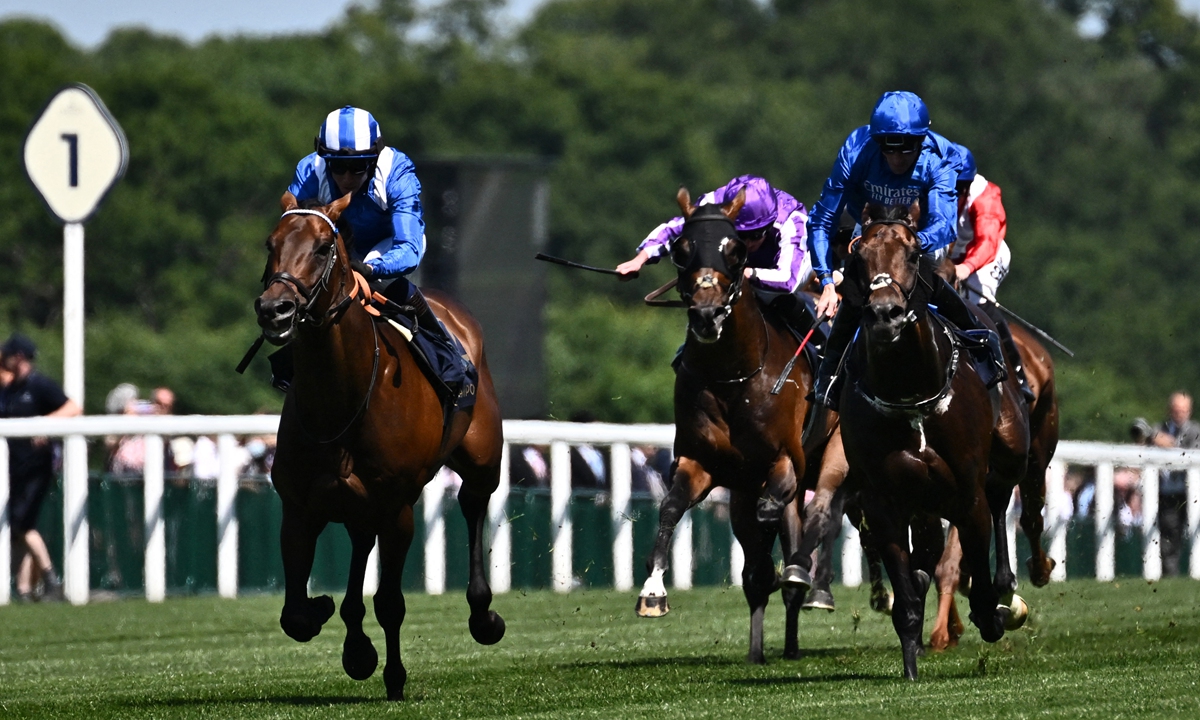 British jockey Jim Crowley rides Baaeed (left) to win the Queen Anne stakes on the first day of the Royal Ascot horse racing meet in Ascot, west of London on June 14, 2022. Photo: AFP