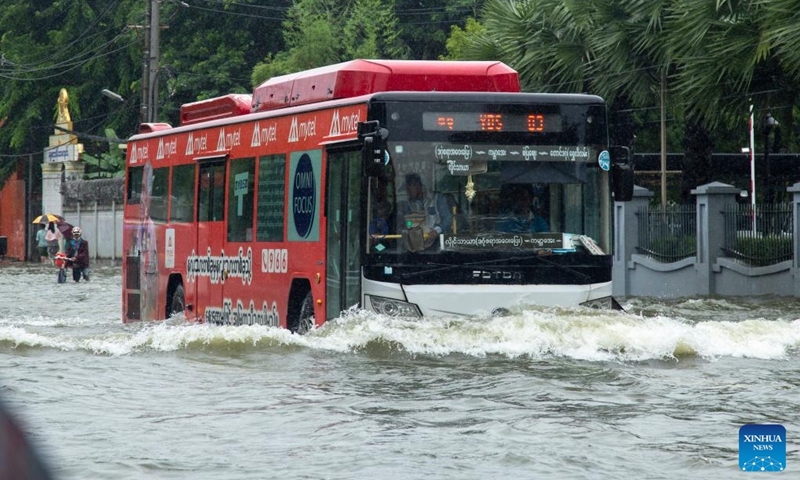 A bus moves on a flooded street after heavy rains in Yangon, Myanmar, Aug. 17, 2022.(Photo: Xinhua)
