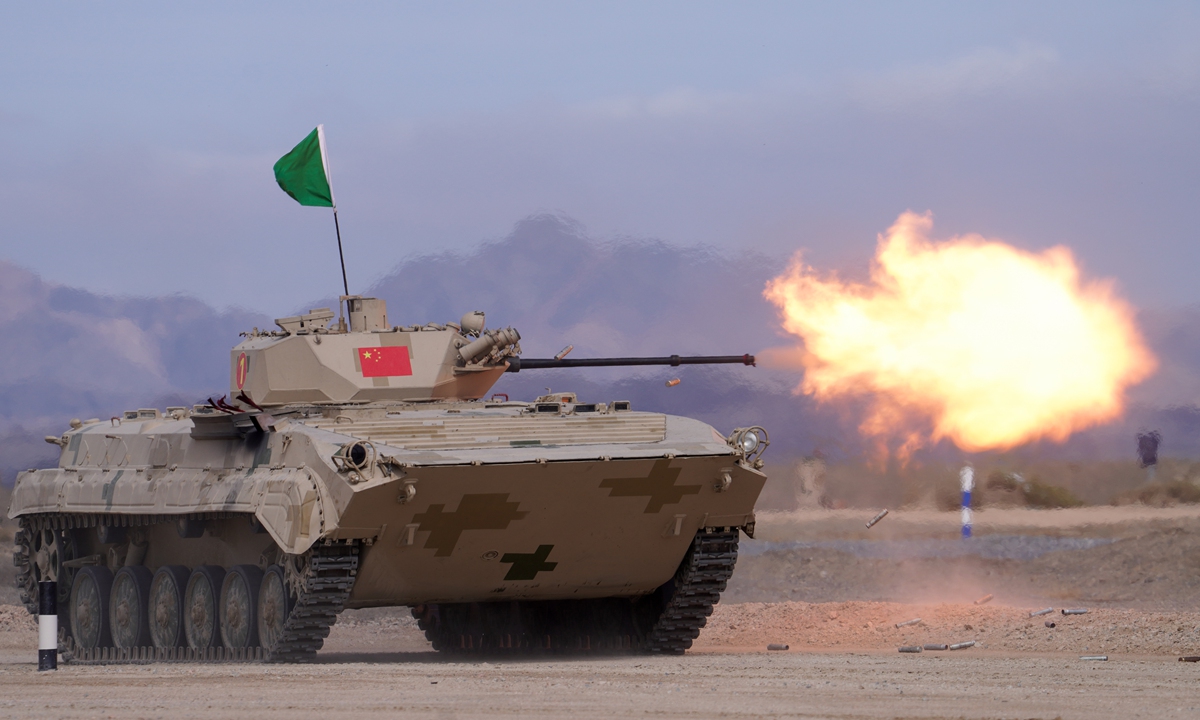 The Chinese People's Liberation Army team fires during the Suvorov Attack relay race in the International Army Games 2022 competition in Korla, Northwest China's Xinjiang Uygur Autonomous Region. The team came first in the race on August 21, 2022, with the best record in the competition's history. Photo: cnsphotos