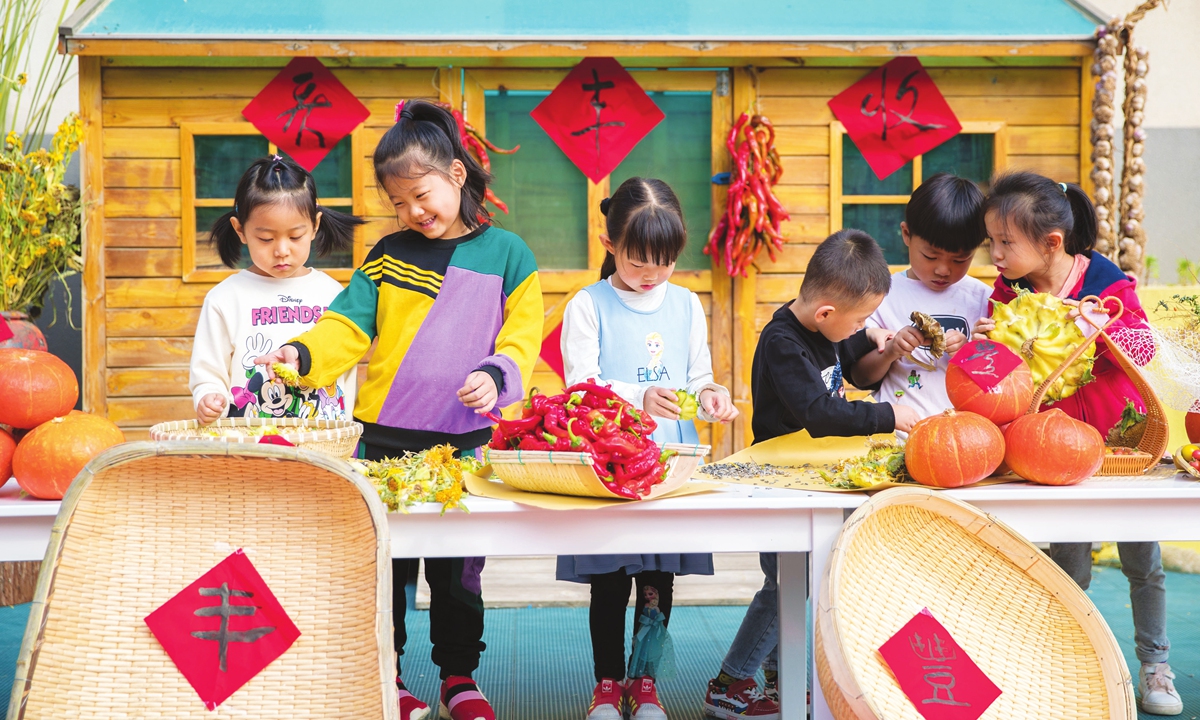 Children in a kindergarten in Hohhot, North China's Inner Mongolia Autonomous Region celebrate harvest in September 2021. Photo: VCG