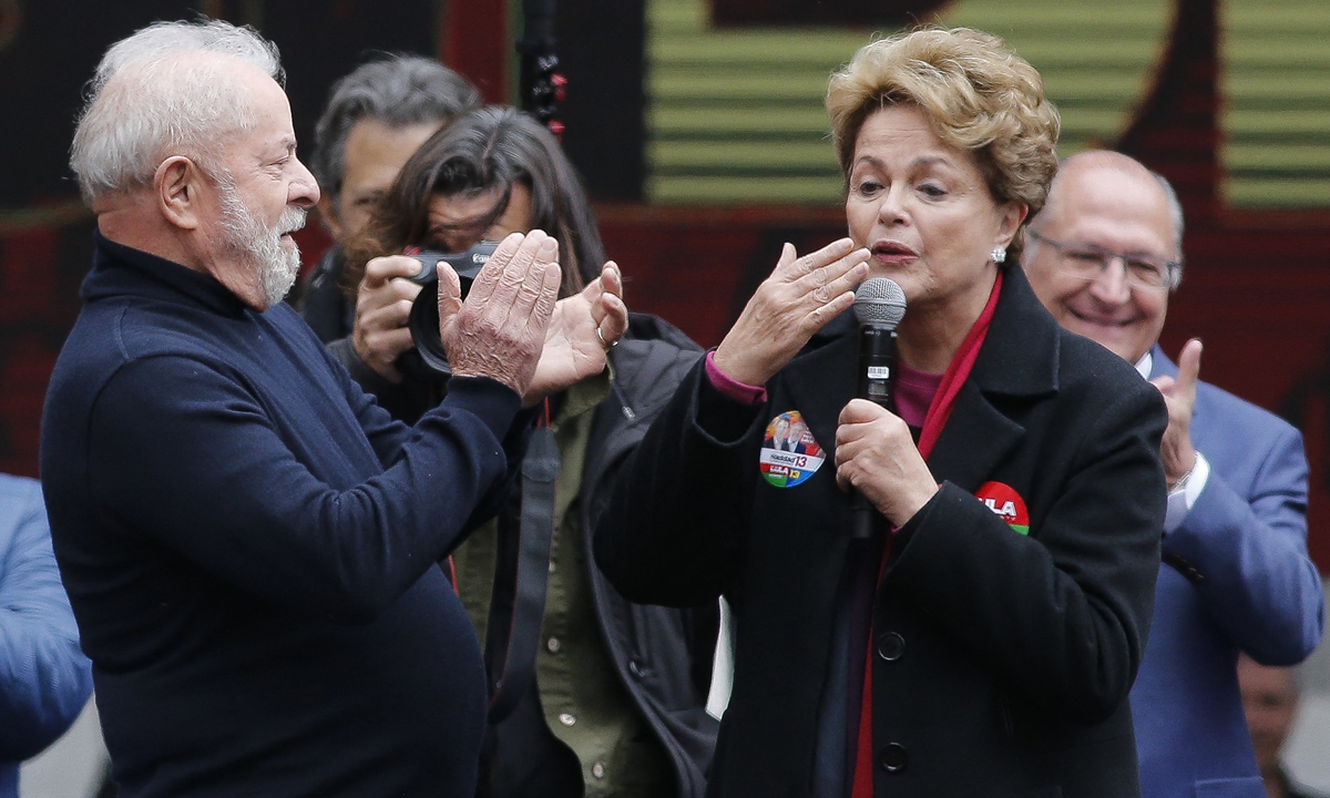Brazilian presidential candidate for the Workers' Party and former president (2003-10), Luiz Inacio Lula da Silva (left) greets ex-president (2011-16) Dilma Rousseff during a campaign rally, in Sao Paulo, Brazil, on August 20, 2022. A recent poll showed Lula maintains a significant lead over current President Jair Bolsonaro. Photo: AFP