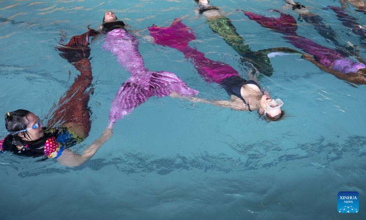 Trainees practise mermaid swimming at the Merschool in Johannesburg, South Africa, Aug 26, 2022. Photo:Xinhua