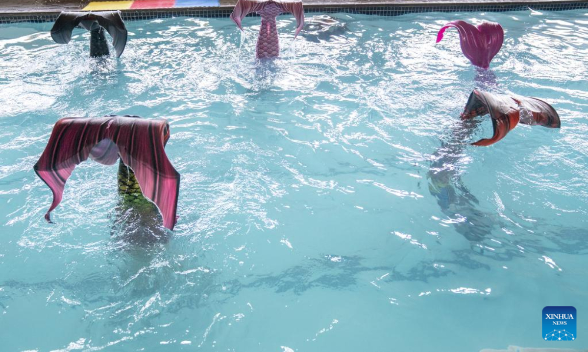 Trainees practise mermaid swimming at the Merschool in Johannesburg, South Africa, Aug 26, 2022. Photo:Xinhua
