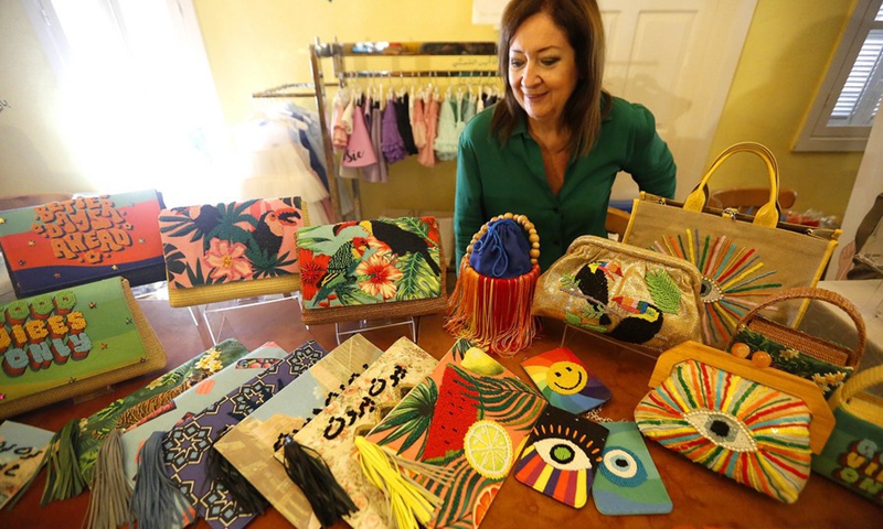 Fashion handbags are displayed in the exhibition I Love Lebanon in Beirut, Lebanon, on Aug. 24, 2022.(Photo: Xinhua)