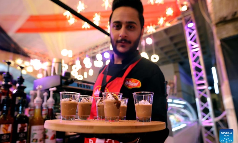 A barista prepares coffee for visitors during the 2022 Amman Coffee Festival in Amman, Jordan, on Aug. 25, 2022. The 2022 Amman Coffee Festival kicked off here on Thursday to promote the consumption of coffee products.(Photo: Xinhua)