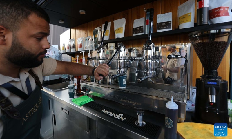 A barista prepares coffee for visitors during the 2022 Amman Coffee Festival in Amman, Jordan, on Aug. 25, 2022. The 2022 Amman Coffee Festival kicked off here on Thursday to promote the consumption of coffee products.(Photo: Xinhua)