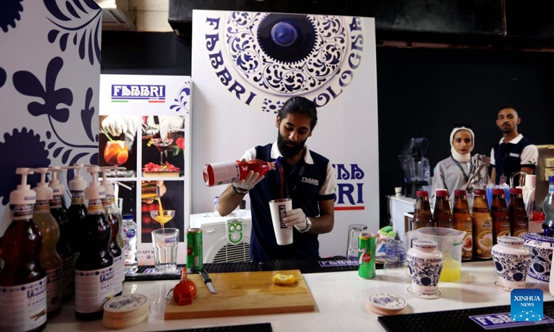 A barista prepares coffee for visitors during the 2022 Amman Coffee Festival in Amman, Jordan, on Aug. 25, 2022. The 2022 Amman Coffee Festival kicked off here on Thursday to promote the consumption of coffee products. (Photo: Xinhua)