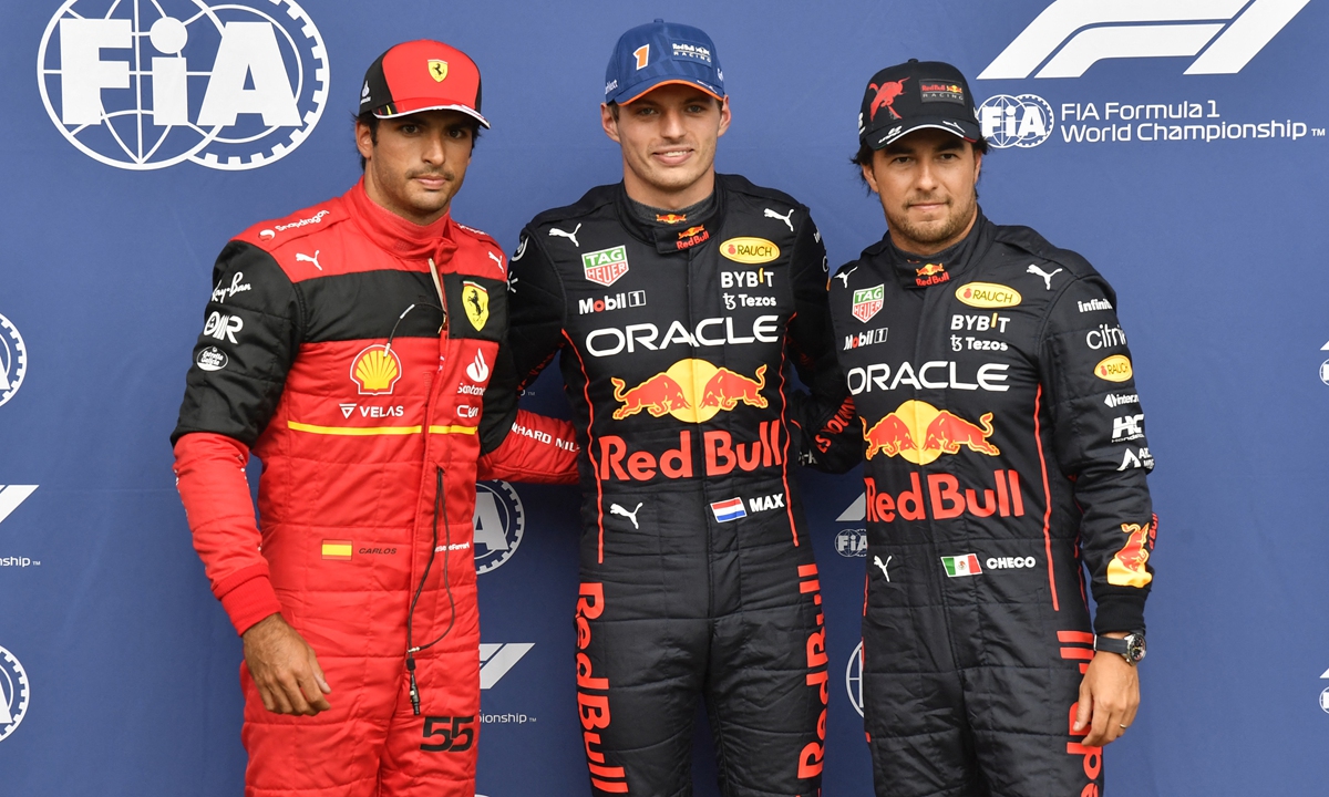 (From left) Ferrari's Carlos Sainz Jr, Red Bull Racing's Max Verstappen and Sergio Perez pose after the qualifying session for the Belgian Formula One Grand Prix in Spa, Belgium on August 27, 2022. Photos: AFP 