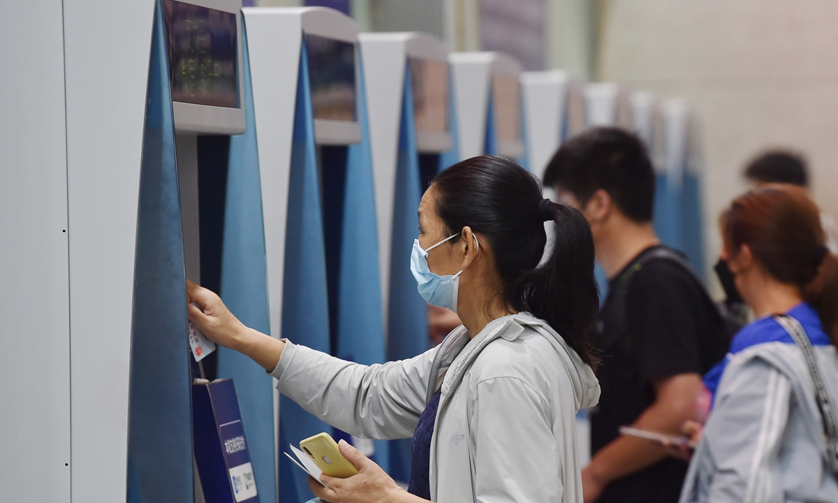 Tourists buy train tickets at Nanjing Railway Station in Nanjing, East China's Jiangsu Province on August 27, 2022. August 27 is the first day for train tickets to be sold for Mid-Autumn Festival, a time of reunion for families. The festival is usually held on the 15th day of the 8th month of the Chinese calendar. This year's Mid-Autumn Festival falls on September 10. Photo: VCG