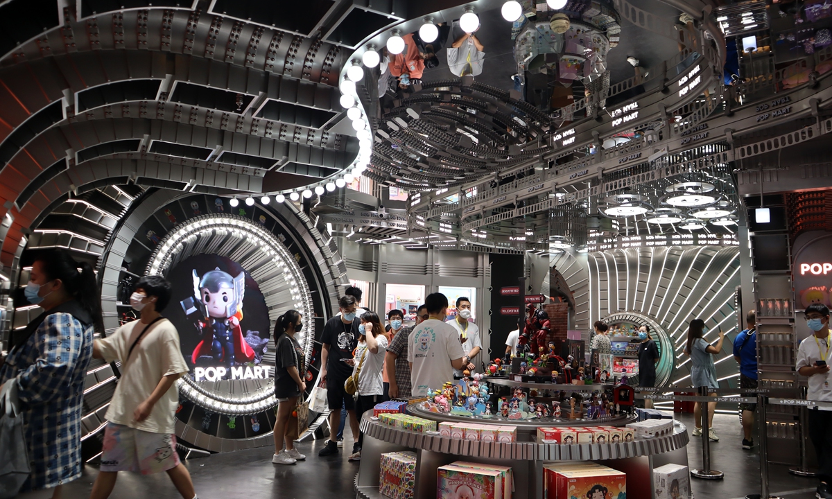 Customers stroll around the newly opened POP MART global flagship store in Nanjing Road in Shanghai on August 29, 2022. China's trendy toy market, headed by blind box toys and others, is valued at 47.8 billion yuan ($6.92 billion) in 2022, according to an industry report. Photo: VCG