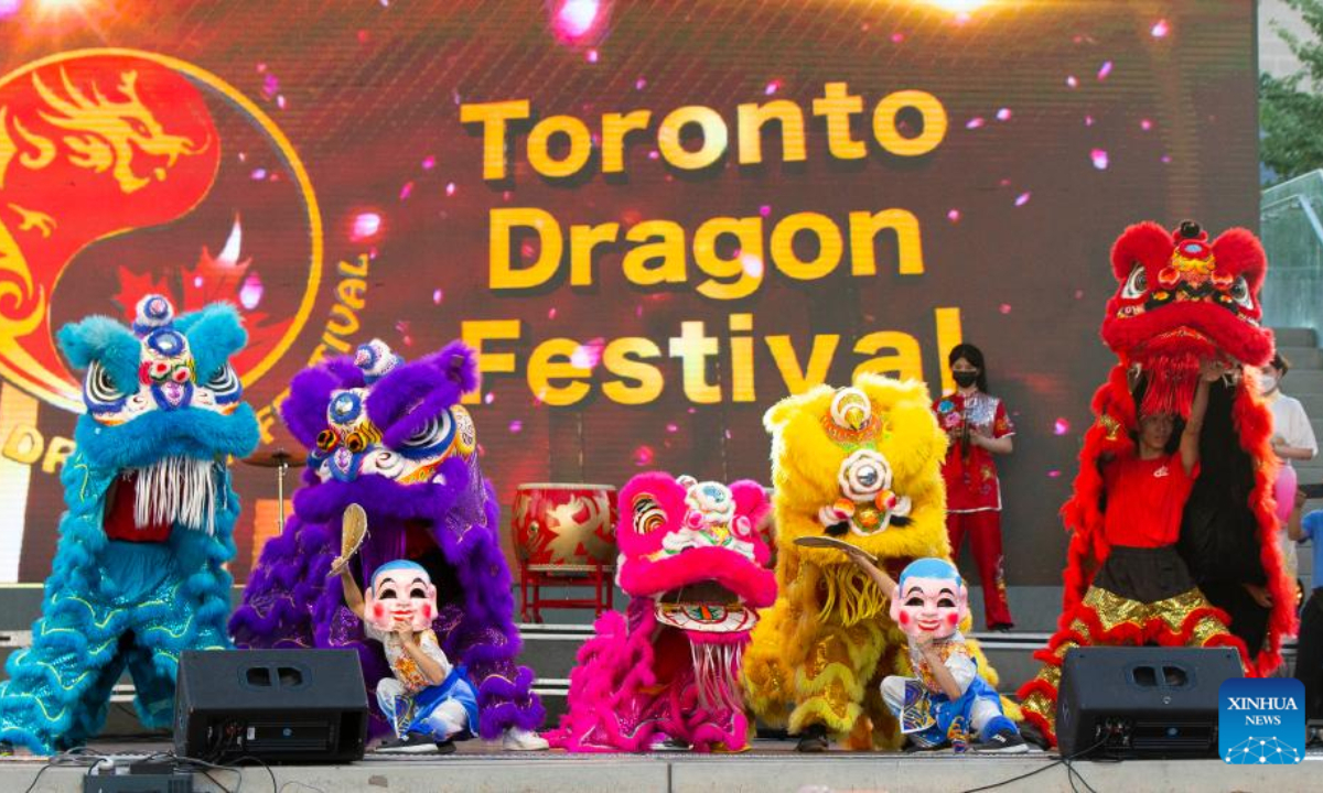 Lion dancers perform during the Toronto Dragon Festival at Nathan Phillips Square in Toronto, Canada, Sep 2, 2022. Photo:Xinhua