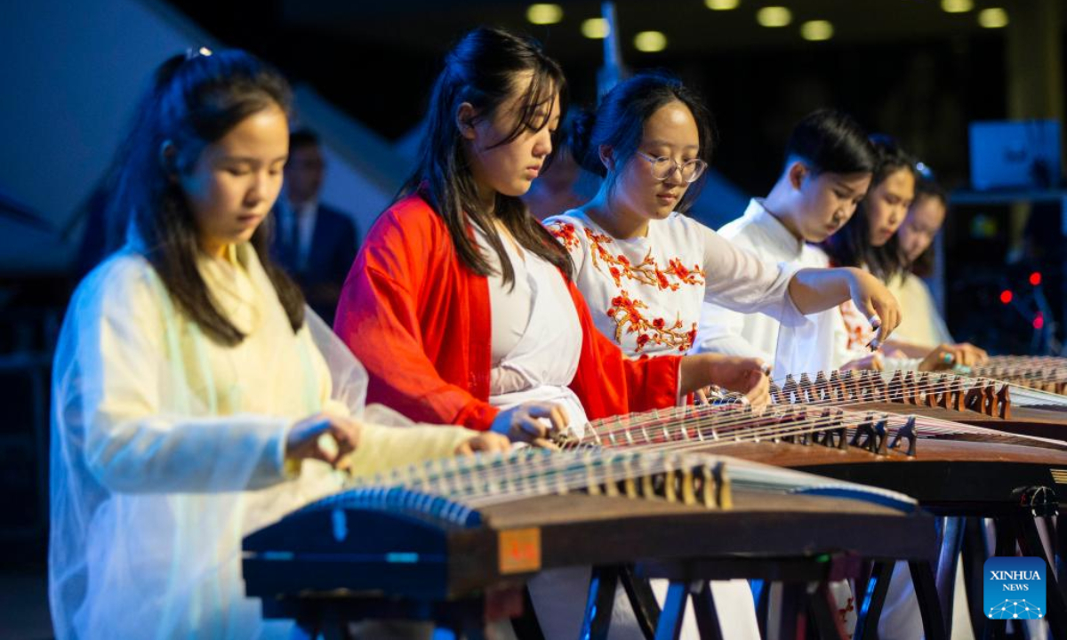 Dressed-up performers play Guzheng, or Chinese zither, during the Toronto Dragon Festival at Nathan Phillips Square in Toronto, Canada, Sep 2, 2022. Photo:Xinhua