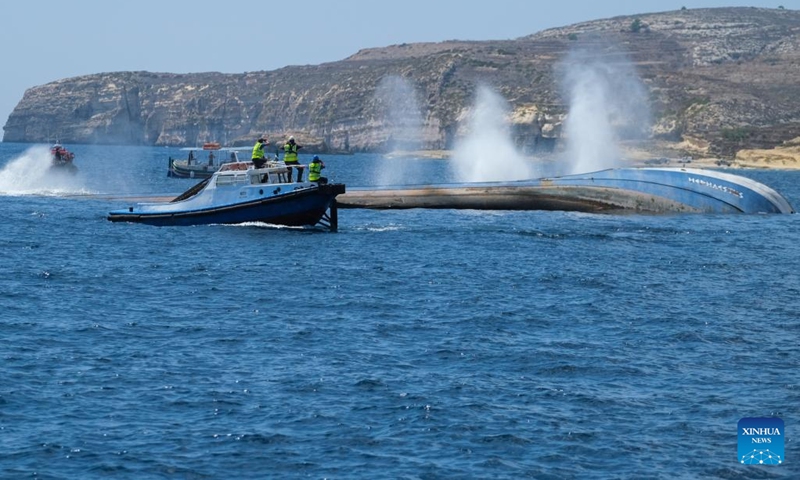 Photo taken on Aug. 29, 2022 shows an oil tanker being scuttled in Gozo, Malta. A 60-meter wide and 855-tonne heavy oil tanker was scuttled off Gozo island on Monday. It will start its new life as an artificial reef to attract divers from local and abroad. The tanker ran aground on the coast of Malta in February 2018 and got retired from service after being found the repair was too costly, according to Maltese media.(Photo: Xinhua)