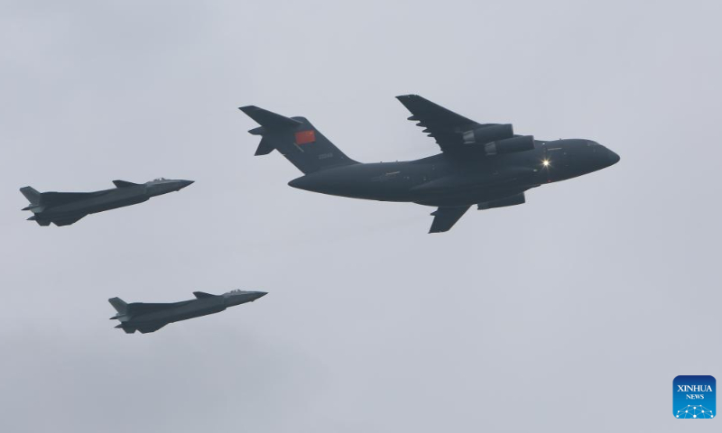 A military aircraft carrying the remains and belongings of Chinese People's Volunteers (CPV) martyrs is escorted by two Chinese fighter jets in Shenyang, capital of Northeast China's Liaoning Province, September 16, 2022. Photo: Xinhua