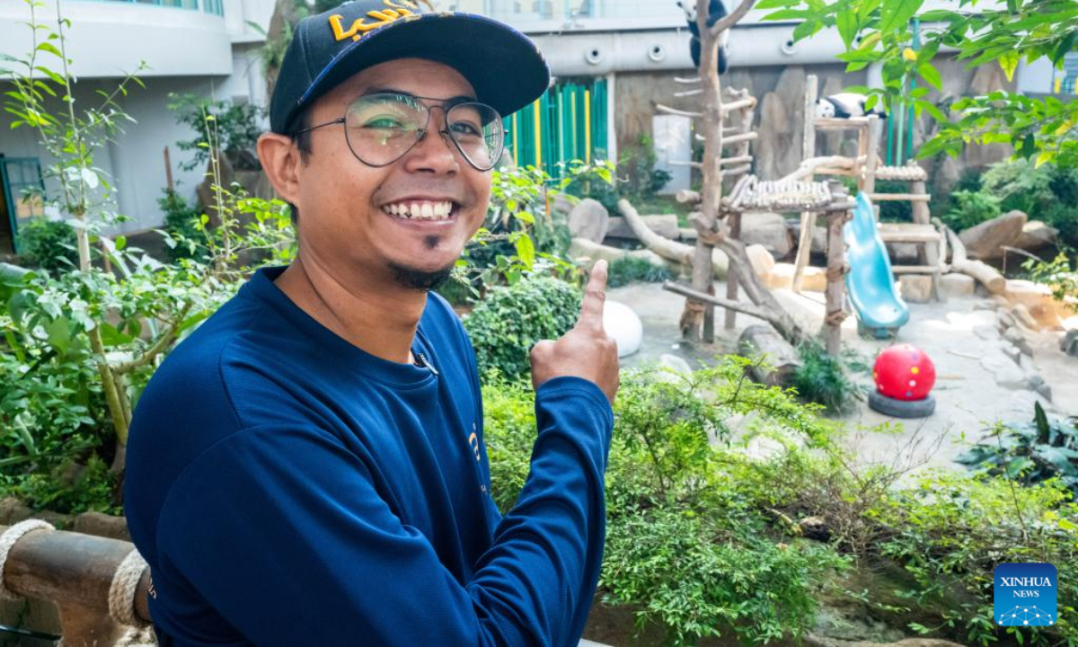 Giant panda caretaker Akmal Hadi Samsuddin poses for photos at the Giant Panda Conservation Center at Zoo Negara near Kuala Lumpur, Malaysia, Aug 21, 2022. Photo:Xinhua