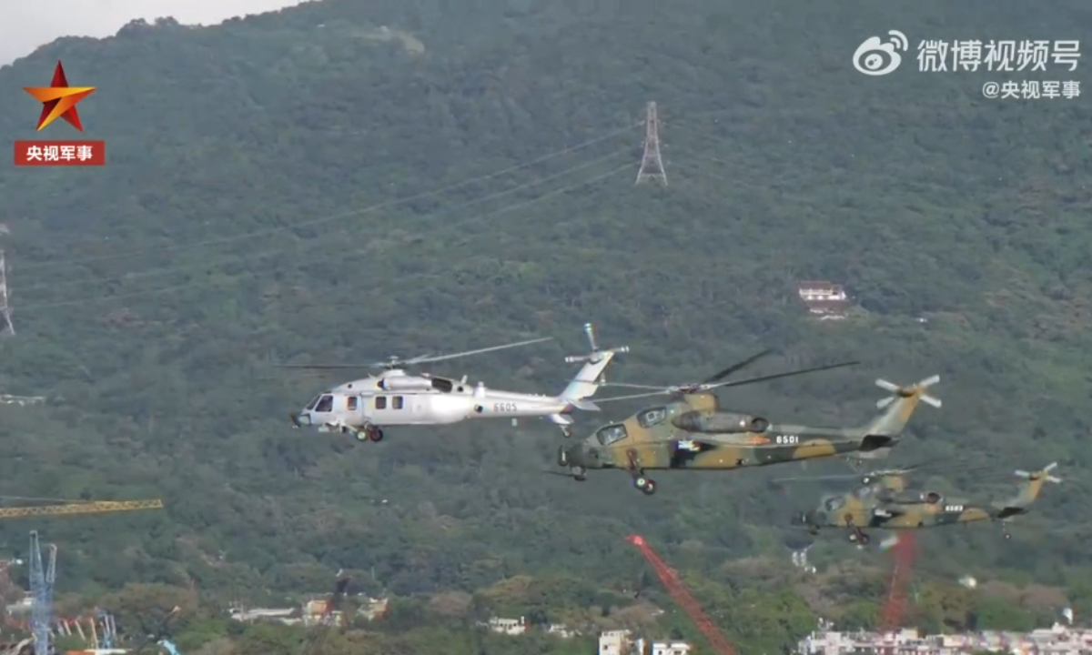 Escorted by two Z-10 attack helicopters, a Z-20 utility helicopter in the colors of the Chinese People’s Liberation Army (PLA) Air Force arrives in Hong Kong on August 29, 2022 as a part of the 25th troop rotation of the PLA Hong Kong Garrison. Photo: Screenshot from China Central Television