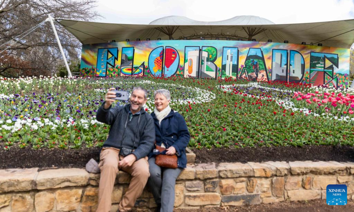 Visitors take a selfie at the festival event of Floriade in the Commonwealth Park in Canberra, Australia, Sep 17, 2022. Photo:Xinhua