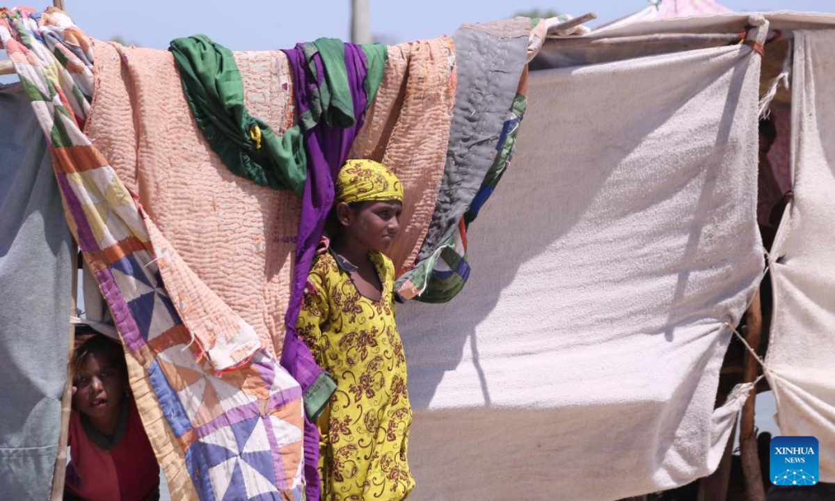 Flood-affected people are seen at a makeshift tent in flood-hit Dadu district in Pakistan's Sindh province on Aug 31, 2022. Photo:Xinhua