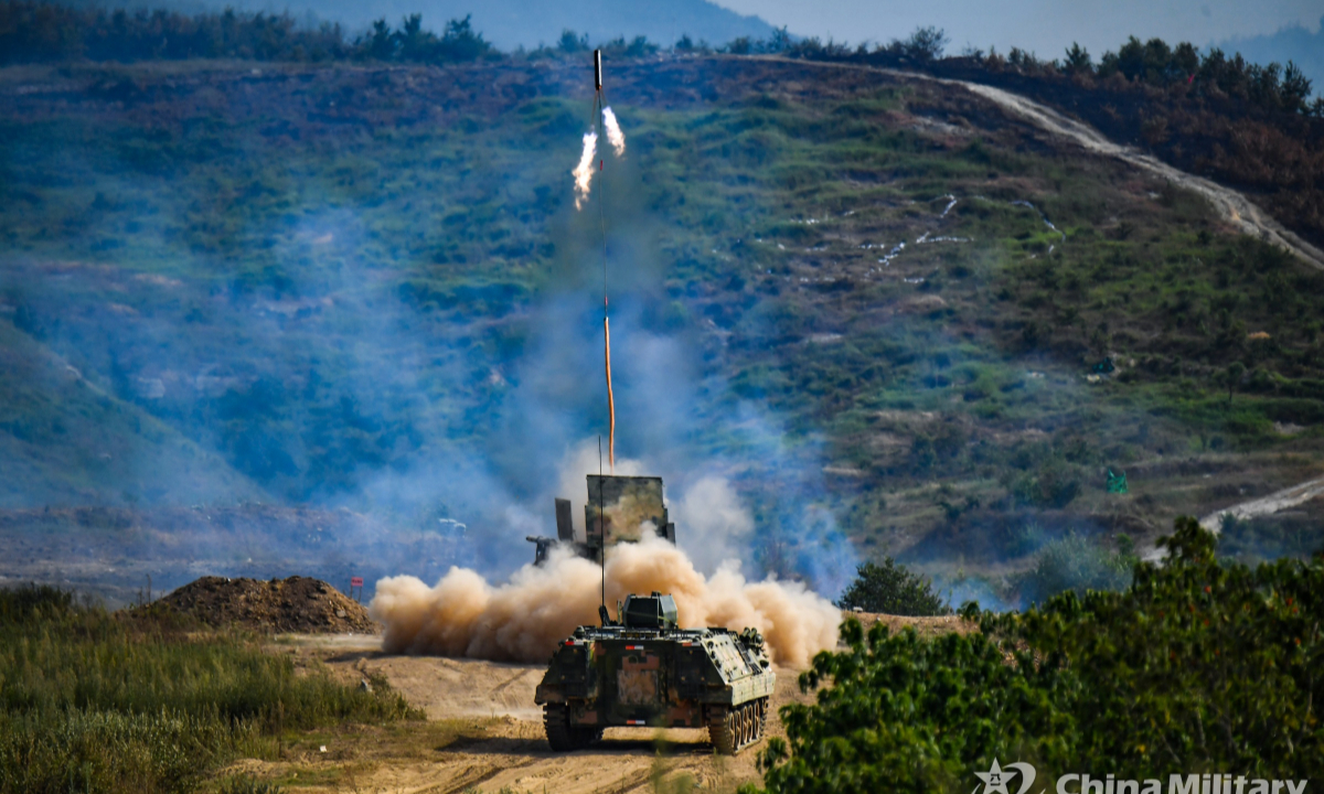 A minefield breaching vehicle (front) attached to a combined-arms brigade with the PLA Army launches a rocket demolition kit during a comprehensive live-fire exercise on August 20, 2022. Photo:China Military
