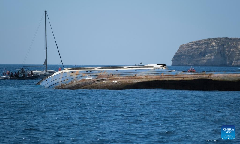 Photo taken on Aug. 29, 2022 shows an oil tanker being scuttled in Gozo, Malta. A 60-meter wide and 855-tonne heavy oil tanker was scuttled off Gozo island on Monday. It will start its new life as an artificial reef to attract divers from local and abroad. The tanker ran aground on the coast of Malta in February 2018 and got retired from service after being found the repair was too costly, according to Maltese media.(Photo: Xinhua)