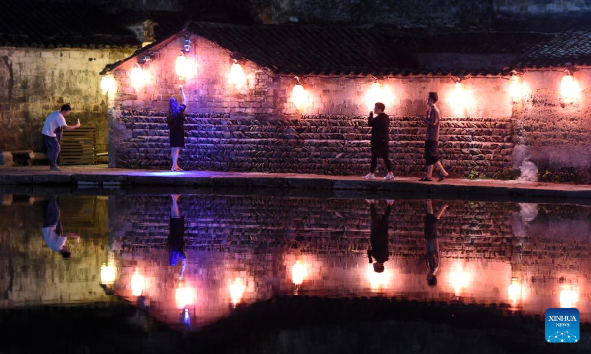 Tourists visit Hongcun Village in Yixian County, east China's Anhui Province, Aug. 31, 2022. Hongcun Village deeply integrates night economy with tourism industry to promote rural development. Photo:Xinhua