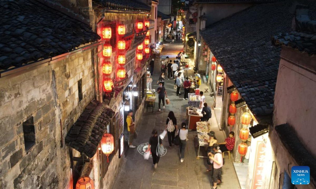 Aerial photo taken on Aug. 31, 2022 shows tourists visiting Hongcun Village in Yixian County, east China's Anhui Province. Hongcun Village deeply integrates night economy with tourism industry to promote rural development. Photo:Xinhua