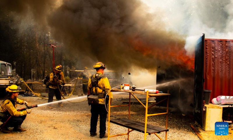 Firefighters attempt to extinguish a fire in the forests near Lake Tahoe in north California, the United States, on Sept. 9, 2022. Multiple forest fires took place recently due to hot and dry weather in California. (Photo by Dong Xudong/Xinhua)