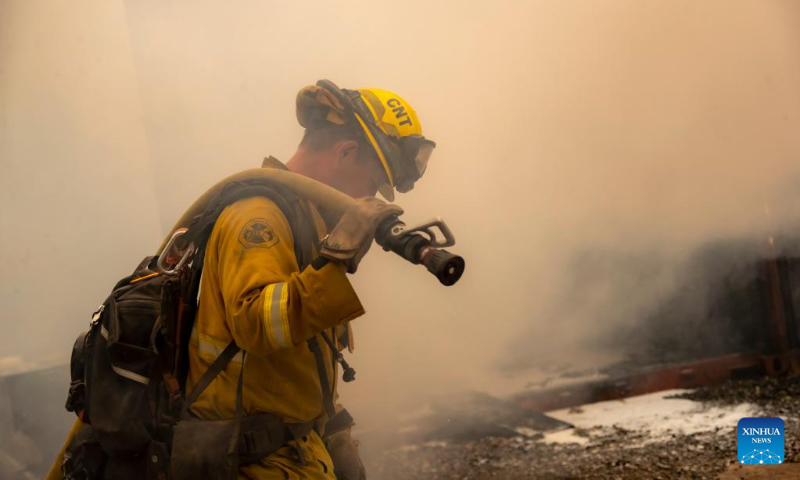 A firefighter works at a fire site in the forests near Lake Tahoe in north California, the United States, on Sept. 9, 2022. Multiple forest fires took place recently due to hot and dry weather in California. (Photo by Dong Xudong/Xinhua)