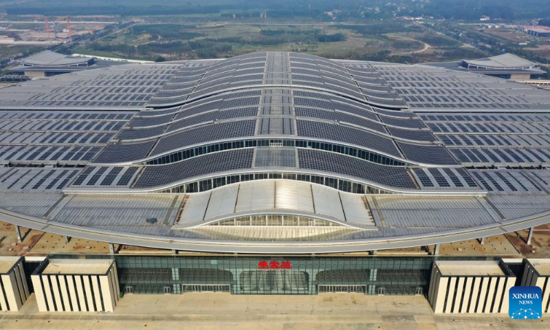 Aerial photo taken on Sept. 9, 2022 shows a distributed photovoltaic (PV) power station on the rooftop of the Xiong'an Railway Station in Xiong'an New Area, north China's Hebei Province. (Xinhua/Xing Guangli)