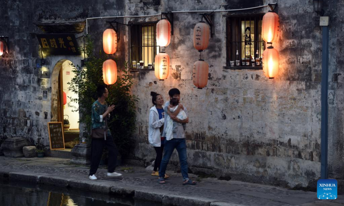 Tourists walk in Hongcun Village in Yixian County, east China's Anhui Province, Aug. 31, 2022. Hongcun Village deeply integrates night economy with tourism industry to promote rural development. Photo:Xinhua
