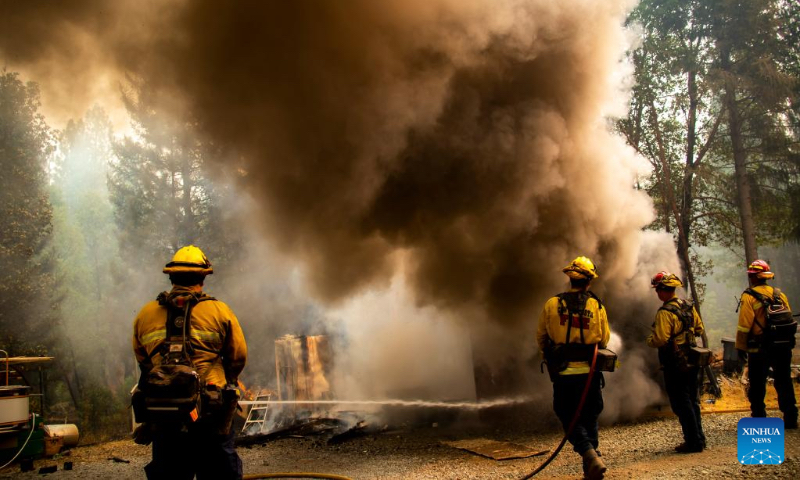 Firefighters attempt to extinguish a fire in the forests near Lake Tahoe in north California, the United States, on Sept. 9, 2022. Multiple forest fires took place recently due to hot and dry weather in California. (Photo by Dong Xudong/Xinhua)