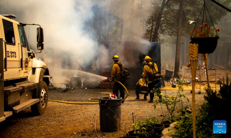 Firefighters attempt to extinguish a fire in the forests near Lake Tahoe in north California, the United States, on Sept. 9, 2022. Multiple forest fires took place recently due to hot and dry weather in California. (Photo by Dong Xudong/Xinhua)