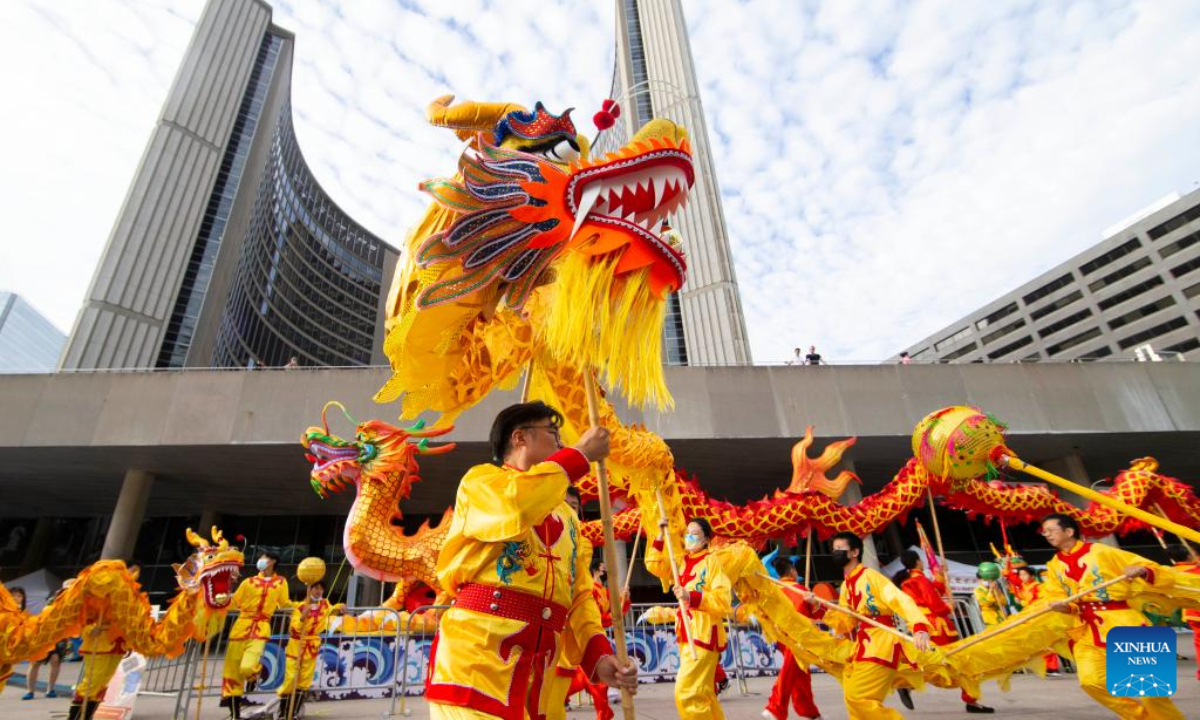 Dragon dancers perform during the Toronto Dragon Festival at Nathan Phillips Square in Toronto, Canada, Sep 2, 2022. Photo:Xinhua