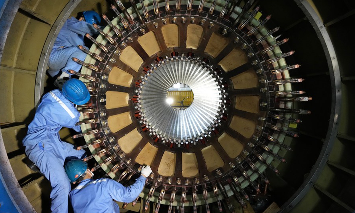 Workers are busy at a factory of Harbin Electric Machinery Company Ltd. of Harbin Electric Corporation in Harbin, northeast China's Heilongjiang Province, Aug. 19, 2022. (Xinhua/Wang Jianwei)