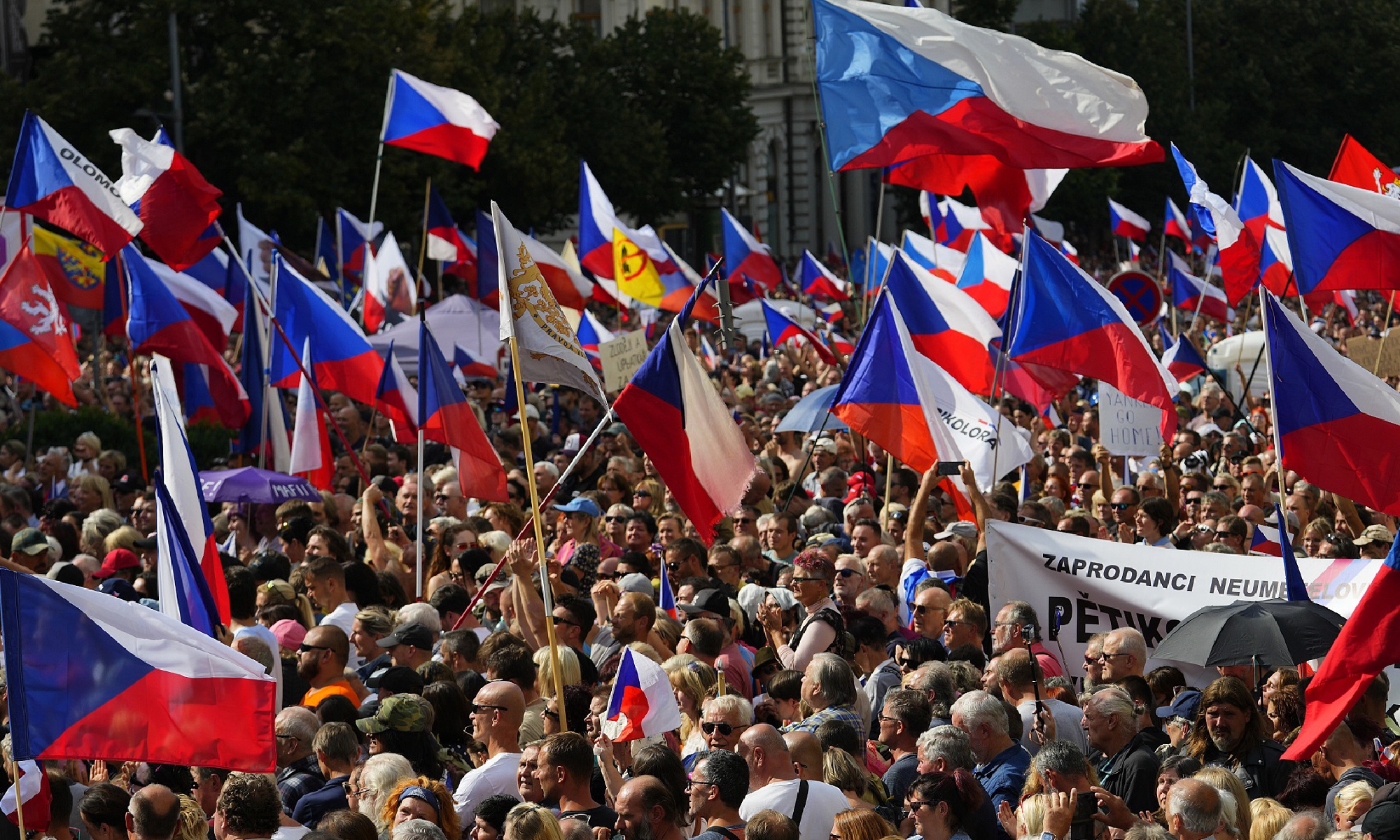 People wave national flags as they protest against Czech government at Wenceslas Square in Prague, Czech Republic, September 3, 2022. According to Czech police, 70,000 people attended a protest calling for the government to resign, while demanding mitigation of the energy crisis and repair of the damage. Photo: VCG