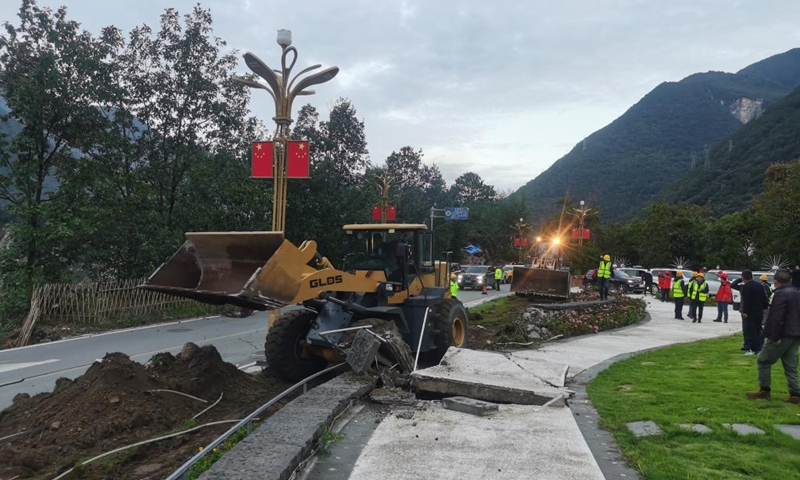 Engineering machines operate to clear a blocked section of the S434 provincial highway after an earthquake in Luding County of southwest China's Sichuan Province on Sept. 6, 2022. A 6.8-magnitude earthquake jolted Luding County on Monday. Rescuers have been organized to restore and maintain damaged road access. (Xinhua)
