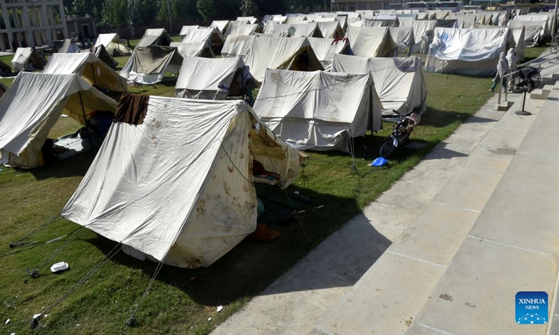 Makeshift tents for flood-affected people are seen in northwest Pakistan's Charsadda on Aug. 31, 2022. The total death toll in Pakistan from this season's monsoon rains since mid-June has risen to at least 1,162, along with 3,554 others injured, the National Disaster Management Authority (NDMA) said.(Photo: Xinhua)