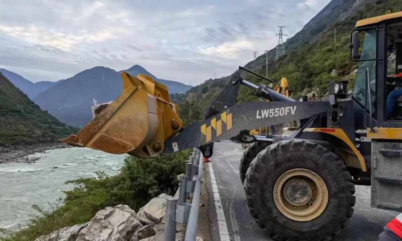 Engineering machines operate to clear a blocked section of the S217 provincial highway after an earthquake in Luding County of southwest China's Sichuan Province on Sept. 6, 2022. A 6.8-magnitude earthquake jolted Luding County on Monday. Rescuers have been organized to restore and maintain damaged road access. (Xinhua)