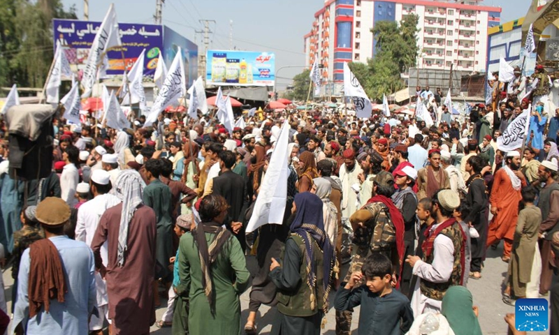 People march on the occasion of the first anniversary of the U.S. forces' withdrawal, in Jalalabad, capital city of Nangarhar province, Afghanistan, Aug. 31, 2022. The Taliban-run caretaker administration has called upon the world community not to pressure the new establishment in Afghanistan but adopt a reasonable policy towards it.(Photo: Xinhua)