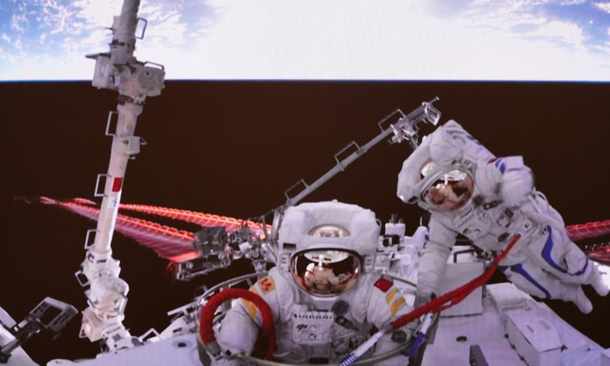 Screen image captured at Beijing Aerospace Control Center on Sept. 2, 2022 shows China's Shenzhou-14 taikonaut Liu Yang (L) returning to the space station lab module Wentian after completing extravehicular activities.
