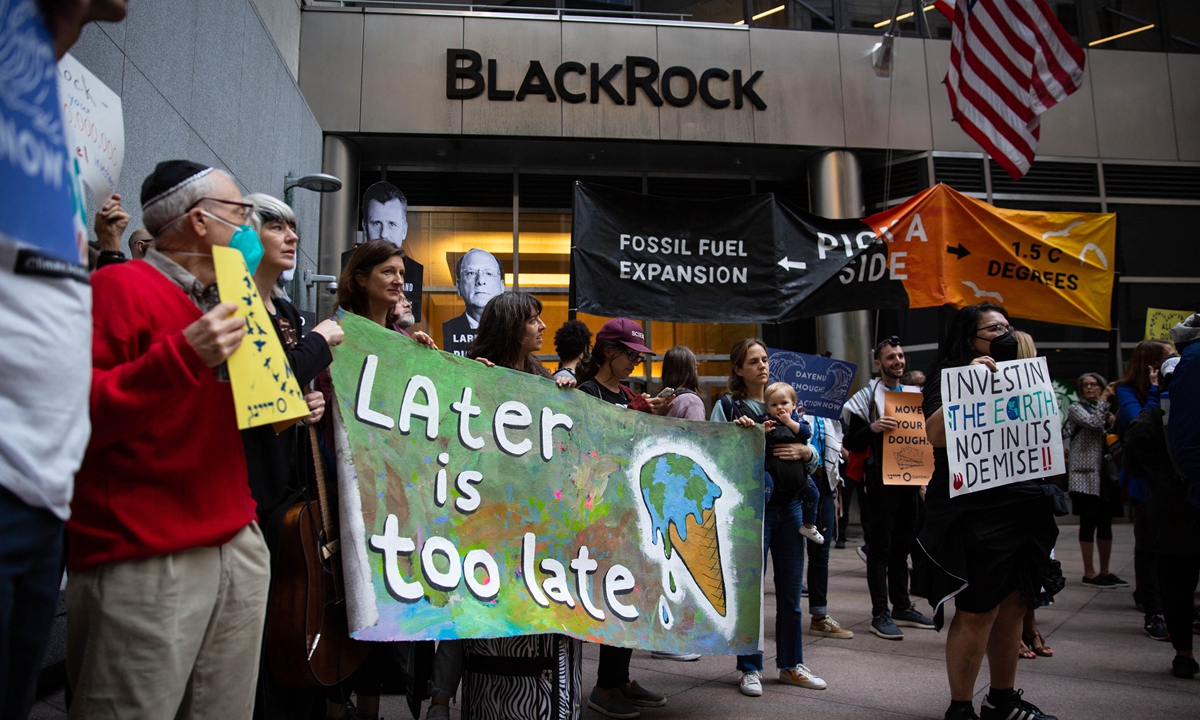 Dozens of demonstrators protest outside of BlackRock in New York, the US, to call for them to stop investing in new fossil fuel projects on May 25, 2022.