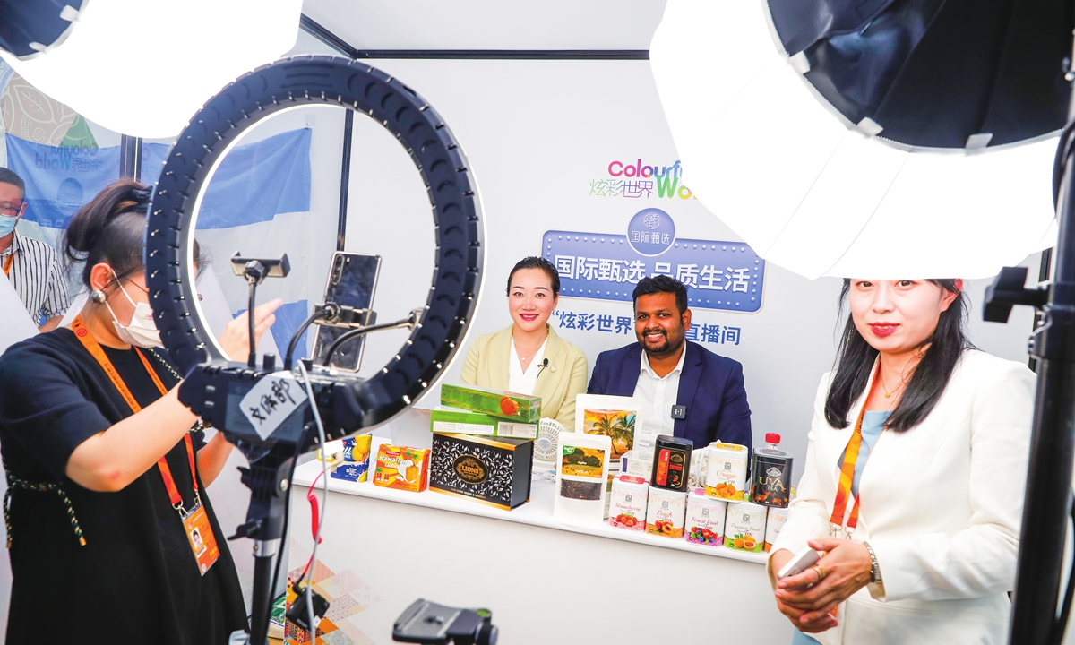 Chiranjaya Udumullage, president of the China Sri Lanka Association for Trade and Economic Cooperation, (right), attends a live commerce event on September 2 during the 2022 CIFTIS in Beijing. Photo: Courtesy of CRI Online 