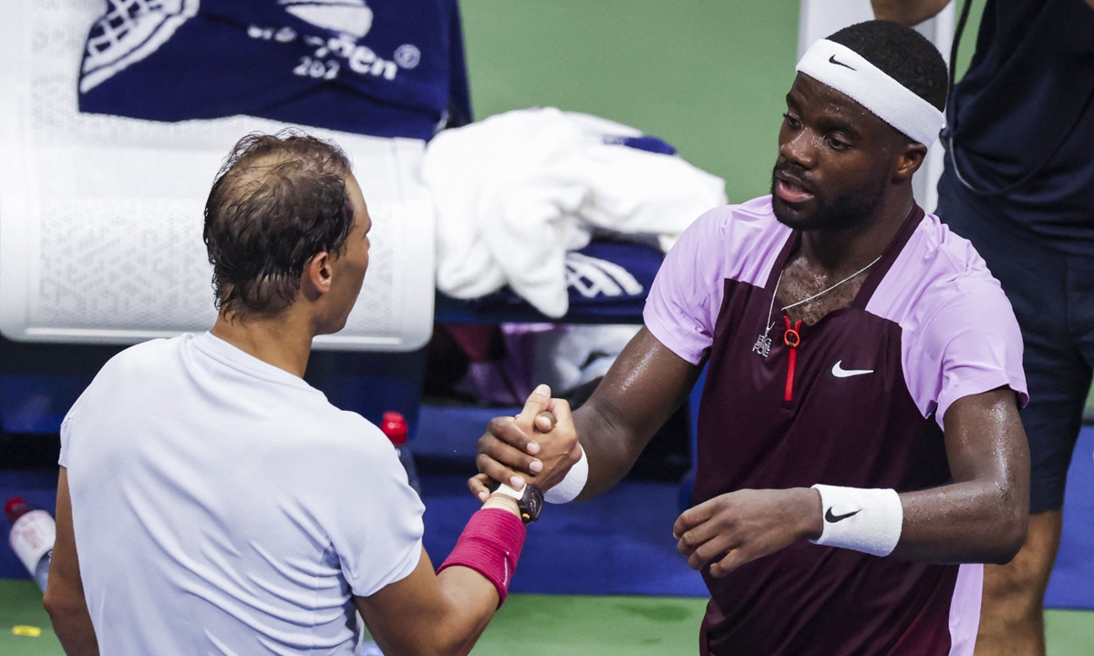 Frances Tiafoe (right) and Rafael Nadal shake hands at the USTA Billie Jean King National Tennis Center in New York, the US on September 5, 2022. Photo: AFP