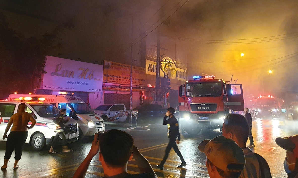 This picture taken on September 6, 2022 and released on September 7 by the Vietnam News Agency shows firefighters at the scene of a deadly fire that engulfed a karaoke bar in Binh Duong province, north of Ho Chi Minh City. Photo: VCG
