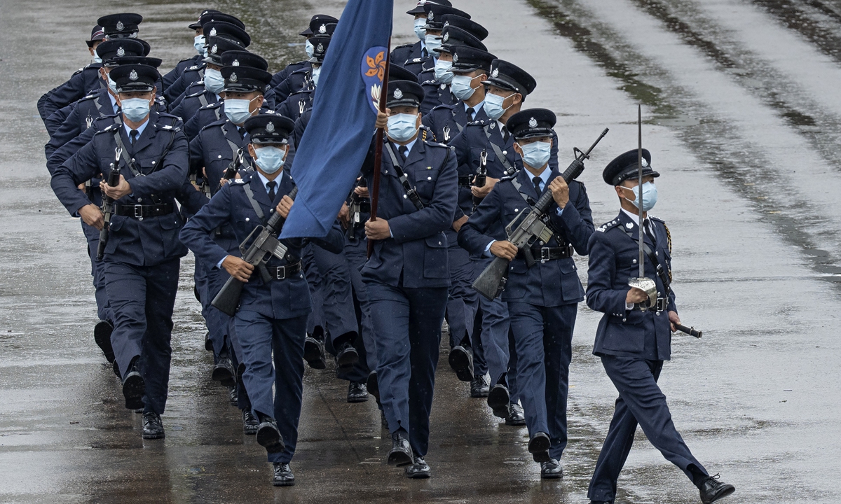Police officers perform Chinese-style foot drills during an open day event for National Security Education Day at the Hong Kong Police College in Hong Kong, China, on April 15, 2021. Starting from October 2021, all officers in Hong Kong have been trained in the PLA-style foot drills with the help of the PLA Hong Kong Garrison. Photo: VCG