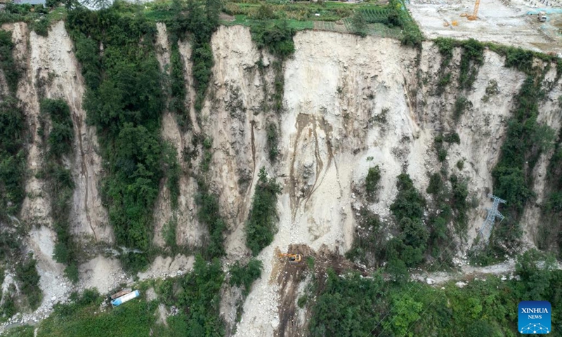 Aerial photo shows rescue workers fixing a road linking to Hailuogou scenic area around Moxi Town of Luding County, southwest China's Sichuan Province, Sept. 7, 2022.(Photo: Xinhua)